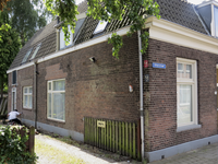 906479 Gezicht op de zijgevel van de voormalige hovenierswoning Otterstraat 115 te Utrecht.